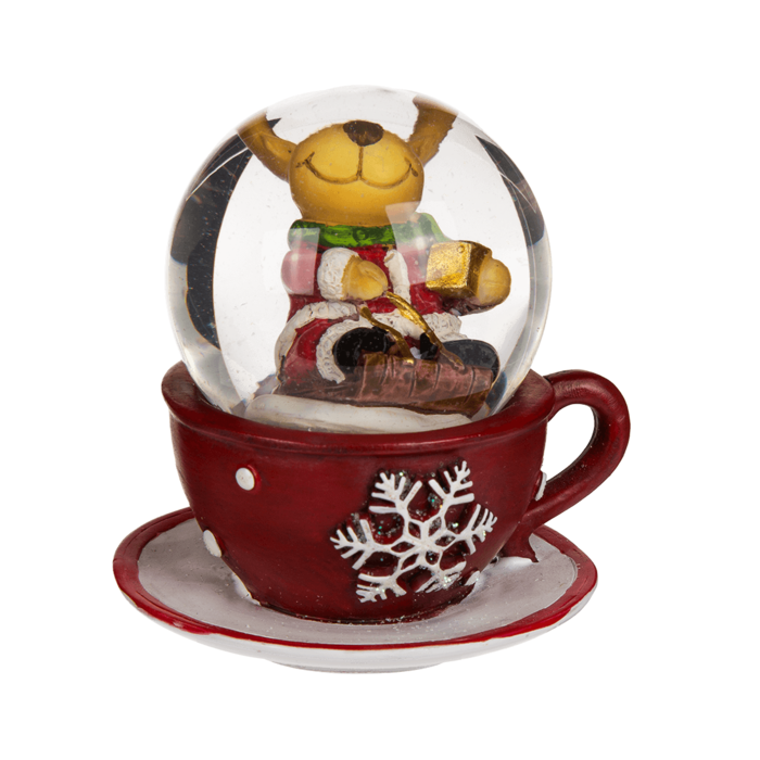 Une Boule à neige en polyrésine avec figurine de Noël sur tasse à café rouge
