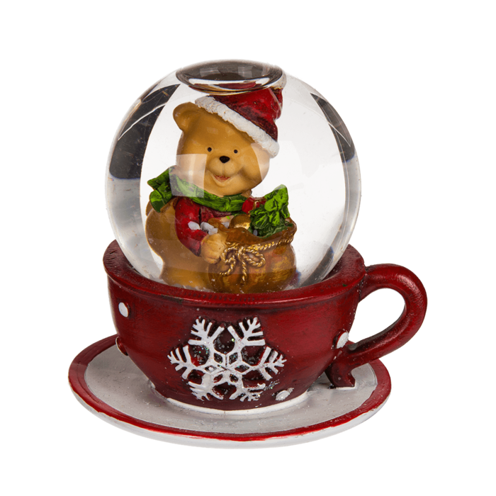 Une Boule à neige en polyrésine avec figurine de Noël sur tasse à café rouge